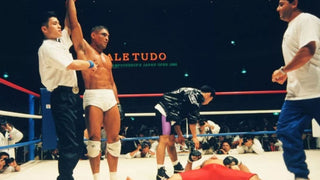 Rickson Gracie raises his arm at Vale Tudo Japan Open MMA fight victory